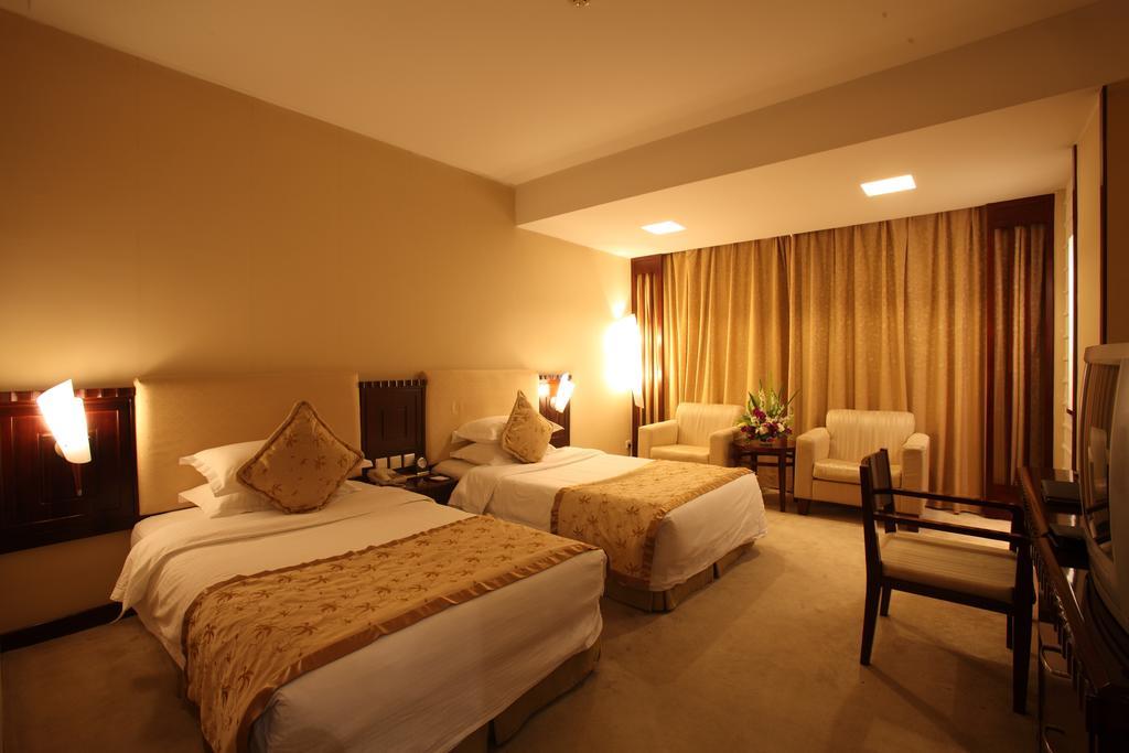 Beijing Wuhuan Hotel Pequim Quarto foto